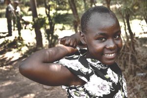 Dark Tones|Moody Orangish - A little girl. Tanzania